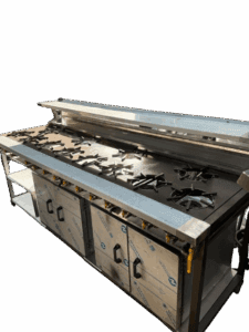 Commercial multi-burner gas cooker, front view — staggered cast burners with cupboard doors below