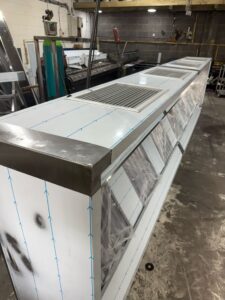 Extraction canopy with fresh-air supply, top view showing the integrated slotted supply-air grille