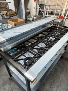 Commercial multi-burner gas cooker on the fabrication stand in our Wednesbury workshop